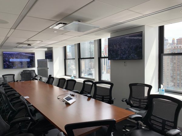 Large Conference Room, facing east, the center three rows of ceiling tiles have been replaced with 4” thick acoustical tiles which aide in absorbing reverberation echoes in the room.